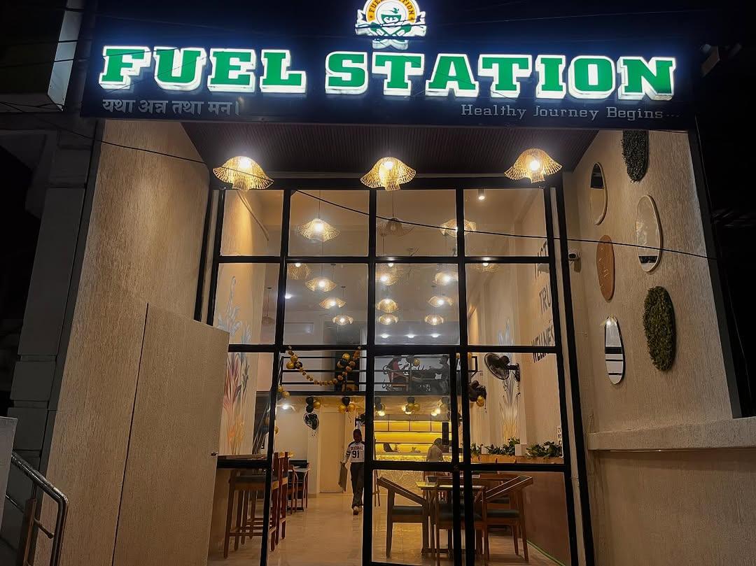 Fuell Station Cafe exterior at night with glowing sign