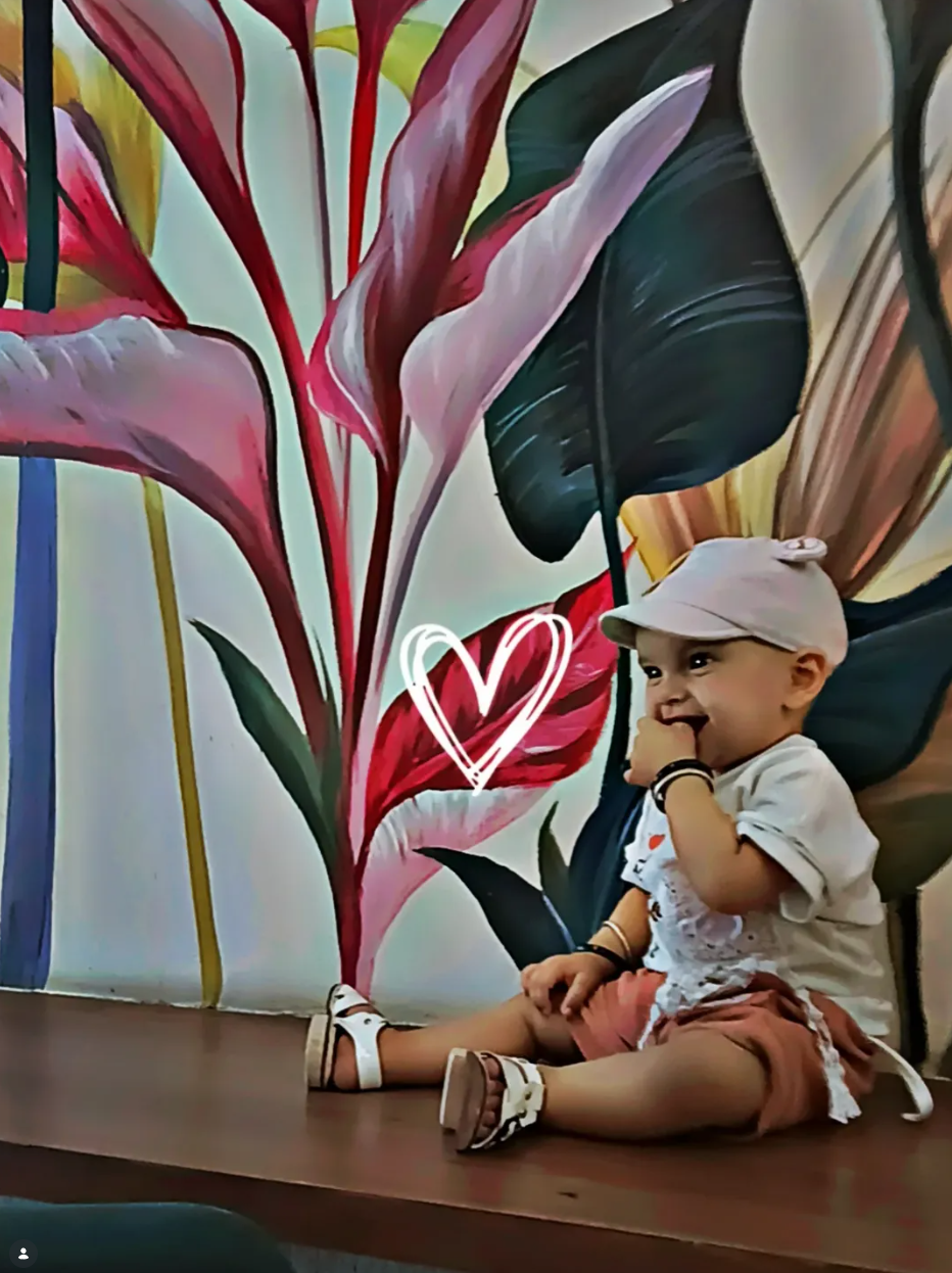 Vibrant botanical mural inside Fuell Station Cafe